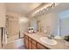 Bathroom with large vanity mirror and combined tub and shower at 4027 E Geddes Cir, Centennial, CO 80122
