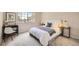 Inviting bedroom featuring a sun-filled window, stylish decor, and comfortable furnishings at 4027 E Geddes Cir, Centennial, CO 80122