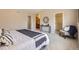 Spacious bedroom featuring modern decor, a comfortable seating area, and ample natural light at 4027 E Geddes Cir, Centennial, CO 80122