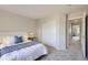 Cozy bedroom features plush carpeting, a comfortable bed, and a convenient closet at 4027 E Geddes Cir, Centennial, CO 80122