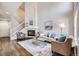 Bright living room with fireplace, vaulted ceiling, and hardwood floors at 4027 E Geddes Cir, Centennial, CO 80122