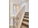Carpeted staircase leading to the upper level with white railing at 4027 E Geddes Cir, Centennial, CO 80122