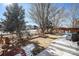 Backyard with a patio, trees, and a brick walkway at 10068 Darwin Ln, Highlands Ranch, CO 80130