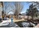 Landscaped backyard with a shed and a patio area at 10068 Darwin Ln, Highlands Ranch, CO 80130