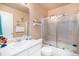 Clean bathroom with a shower/tub combo and a vanity at 10068 Darwin Ln, Highlands Ranch, CO 80130