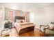 Guest bedroom with hardwood floors and ample closet space at 10068 Darwin Ln, Highlands Ranch, CO 80130