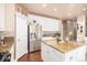 Modern kitchen with stainless steel appliances, granite countertops, and white cabinetry at 10068 Darwin Ln, Highlands Ranch, CO 80130