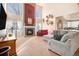 Living room with a high ceiling, fireplace, and large windows at 10068 Darwin Ln, Highlands Ranch, CO 80130