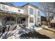 Large covered patio with comfortable seating and outdoor entertaining space at 10068 Darwin Ln, Highlands Ranch, CO 80130