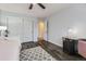 Bedroom featuring wood-look floors, a closet, ceiling fan, and office space at 5426 S Jasper Way, Centennial, CO 80015