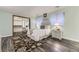Bedroom with wood floors, a decorative rug, and mirrored closet doors offering style and function at 5426 S Jasper Way, Centennial, CO 80015