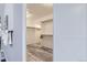 Walk-in closet featuring ample storage space, built-in shelving, and a sliding barn door at 5426 S Jasper Way, Centennial, CO 80015