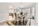 Elegant dining room with stylish chandelier and view to the kitchen at 5426 S Jasper Way, Centennial, CO 80015