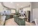Modern kitchen features granite counters, stainless appliances, and a functional center island at 5426 S Jasper Way, Centennial, CO 80015