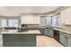 Bright, open kitchen with granite counters, updated appliances and spacious center island at 5426 S Jasper Way, Centennial, CO 80015