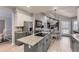 Open concept kitchen with granite island, stainless steel appliances, and adjacent dining area at 5426 S Jasper Way, Centennial, CO 80015