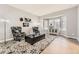 Cozy living room with bay window, stylish furnishings, and modern light gray wall paint at 5426 S Jasper Way, Centennial, CO 80015