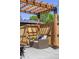 Outdoor patio seating area with a pergola and comfortable cushioned furniture at 2355 N Emerson St, Denver, CO 80205