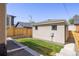 Well-maintained backyard with lush green grass and a detached structure at 2355 N Emerson St, Denver, CO 80205