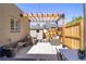 Backyard patio featuring a pergola and comfortable seating, perfect for outdoor relaxation at 2355 N Emerson St, Denver, CO 80205
