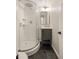 Modern bathroom featuring a glass shower, a stylish vanity, and sleek fixtures at 2355 N Emerson St, Denver, CO 80205