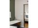 Bathroom featuring a freestanding tub and a view into the bedroom at 2355 N Emerson St, Denver, CO 80205