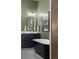 Stylish bathroom with a modern vanity, sleek mirror, and a freestanding tub at 2355 N Emerson St, Denver, CO 80205