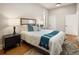 Cozy bedroom with a comfortable bed, stylish nightstands, and ample natural light from the window at 2355 N Emerson St, Denver, CO 80205