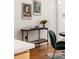 Dining room with a modern console table, curated decor, and a view of a nearby chair at 2355 N Emerson St, Denver, CO 80205
