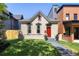 Charming home exterior featuring a well-manicured lawn and classic architectural details at 2355 N Emerson St, Denver, CO 80205