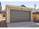 Detached garage with a concrete driveway and neutral paint, providing ample parking and storage space at 2355 N Emerson St, Denver, CO 80205