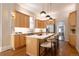 Modern kitchen boasts stainless steel appliances, custom cabinets, and a spacious island with bar seating at 2355 N Emerson St, Denver, CO 80205