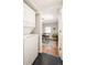 View of the laundry room with a stacked washer and dryer next to a home office space at 2355 N Emerson St, Denver, CO 80205