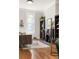 Bright living room with hardwood floors, fireplace, bookshelves, and ample natural light at 2355 N Emerson St, Denver, CO 80205