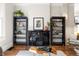 Inviting living room featuring a vintage fireplace, elegant bookshelves, and stylish decor at 2355 N Emerson St, Denver, CO 80205
