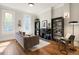 Inviting living room with hardwood floors, a fireplace, and built-in bookshelves at 2355 N Emerson St, Denver, CO 80205