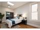Serene bedroom with a skylight, hardwood floors, neutral paint, and a modern en suite bathroom at 2355 N Emerson St, Denver, CO 80205