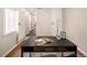 Office with a modern desk, natural light, and views of the hallway at 2355 N Emerson St, Denver, CO 80205
