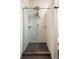 Modern tiled shower with a glass enclosure and rain style shower head at 2355 N Emerson St, Denver, CO 80205