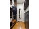 Organized walk-in closet with custom shelving and a mirror for a modern and efficient storage solution at 2355 N Emerson St, Denver, CO 80205