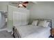 Bedroom featuring a queen bed, closet, and ceiling fan at 7715 S Hudson Ct, Centennial, CO 80122
