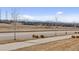 A view of the community, showcasing nearby homes and the beautiful mountain scenery in the distance at 21894 E Tufts Cir, Aurora, CO 80015