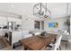 Modern kitchen and living room in an open-concept layout perfect for entertaining at 21894 E Tufts Cir, Aurora, CO 80015