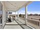 Covered patio with seating and string lights, offering great outdoor living space at 21894 E Tufts Cir, Aurora, CO 80015