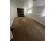 Spacious basement featuring a brick fireplace and large windows for natural light at 1533 S Jamaica St, Aurora, CO 80012