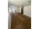 Open basement area with built-in shelving, offering ample storage or display space at 1533 S Jamaica St, Aurora, CO 80012