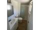 Bathroom featuring a white vanity, toilet, and walk-in shower at 1533 S Jamaica St, Aurora, CO 80012