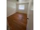 Bedroom featuring hardwood floors and a window with natural light at 1533 S Jamaica St, Aurora, CO 80012