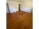Bedroom with closet, hardwood floors, and an interior door at 1533 S Jamaica St, Aurora, CO 80012
