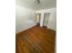 Cozy bedroom with hardwood floors, closet, and interior door at 1533 S Jamaica St, Aurora, CO 80012